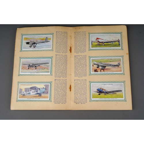 458 - Four 1930s cigaratte card albums to include: John Player & Sons Motor Cars (1st and 2nd Series)  and... 