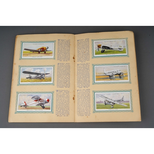 458 - Four 1930s cigaratte card albums to include: John Player & Sons Motor Cars (1st and 2nd Series)  and... 