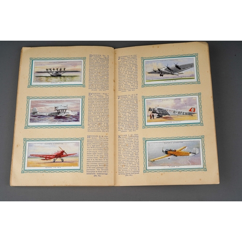 458 - Four 1930s cigaratte card albums to include: John Player & Sons Motor Cars (1st and 2nd Series)  and... 