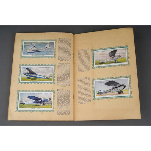 458 - Four 1930s cigaratte card albums to include: John Player & Sons Motor Cars (1st and 2nd Series)  and... 