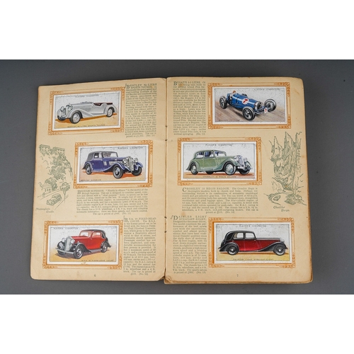 458 - Four 1930s cigaratte card albums to include: John Player & Sons Motor Cars (1st and 2nd Series)  and... 