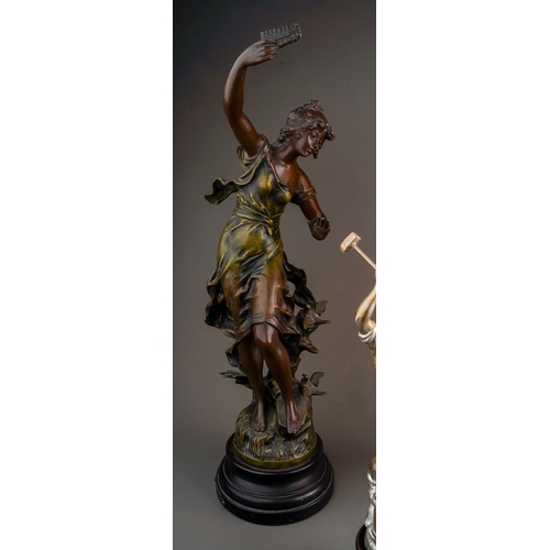 479 - A Spelter figure of a lady, a pair of Spelter figures and a lamp