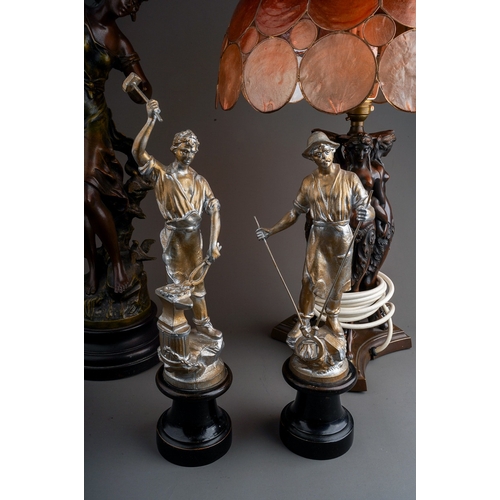 479 - A Spelter figure of a lady, a pair of Spelter figures and a lamp