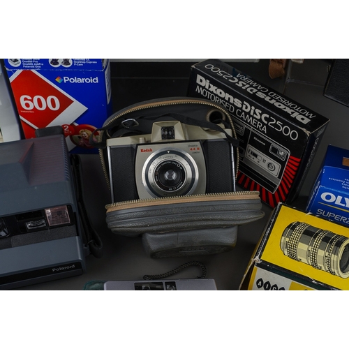 482 - A collection of film and digital camera equipment including Polaroid Spectra 2, 600 polaroid film an... 