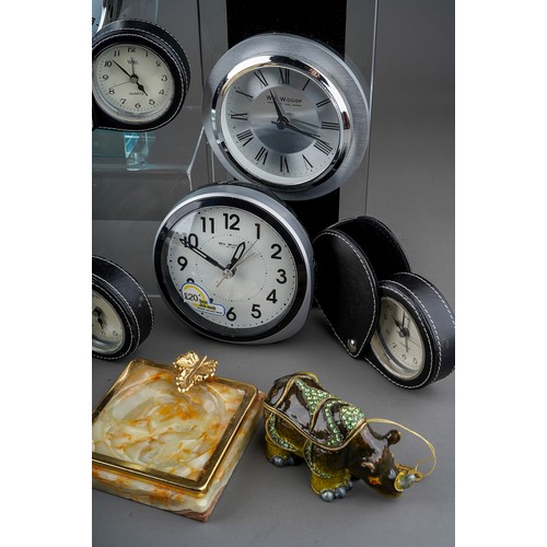 491 - Assorted clocks and table accessories to include: two William Widdop boxed round glass mantel clocks... 