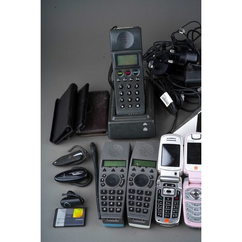 495 - A box containing a collection of various cordless and mobile telephones, including Samsung, NEC, Cel... 