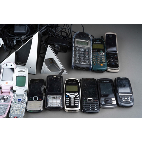 495 - A box containing a collection of various cordless and mobile telephones, including Samsung, NEC, Cel... 