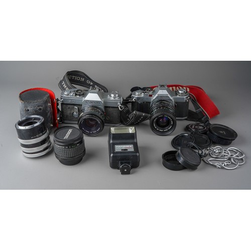 496 - A collection of Canon cameras and lenses including Canon AV-1 camera with 35 - 70mm / F3.5/4.5 lens,... 