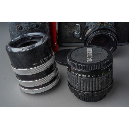 496 - A collection of Canon cameras and lenses including Canon AV-1 camera with 35 - 70mm / F3.5/4.5 lens,... 