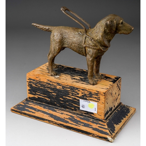 502 - A Modern presentation patinated metal cast of a guide dog with harness on ebonised plinth with plaqu... 