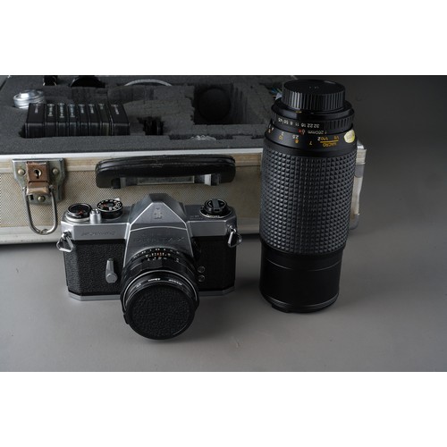 507 - A cased Pentax Spotmatic Film Camera, a Bell & Howell Lens and other accessories