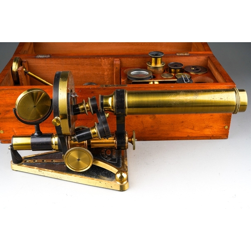 512 - A cased Beck 6745 brass microscope