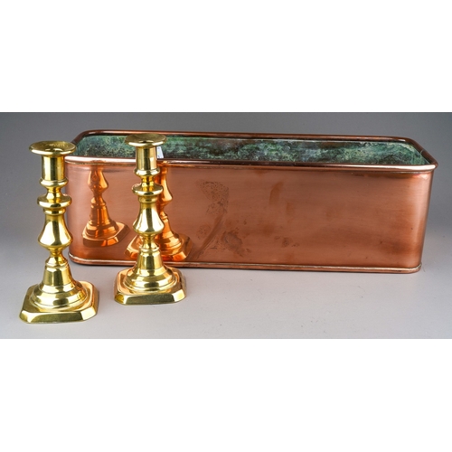 514 - A pair of Victorian brass candlesticks, height 17cm and a 20th century rectangular copper planter, l... 