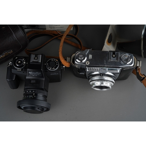 515 - Two cased film cameras, comprising a Minolta 110 Zoom SLR, with Minolta Zoom Rokkor-Macro 25-67mm 1:... 