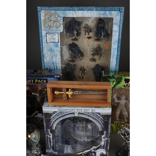 524 - A collection of Lord of the Rings memorabilia, including a pewter figure group of Gandalf and Frodo,... 