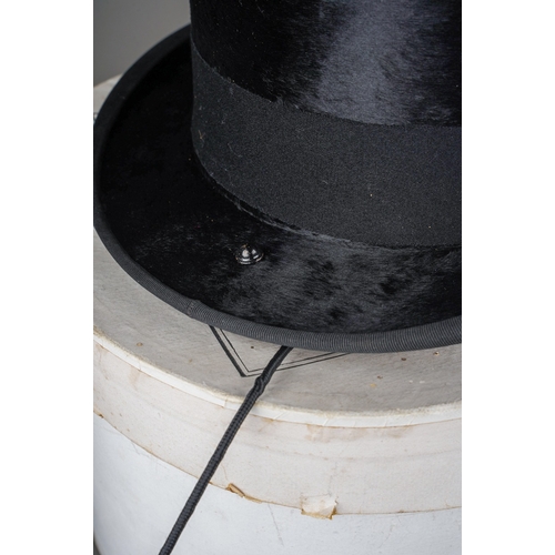 528 - A 1930s Henry Heath Ladies black top hat (part of side saddle habit) with lead and clip to reverse h... 