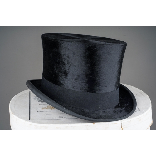 528 - A 1930s Henry Heath Ladies black top hat (part of side saddle habit) with lead and clip to reverse h... 