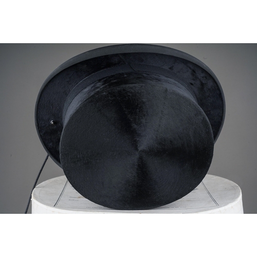 528 - A 1930s Henry Heath Ladies black top hat (part of side saddle habit) with lead and clip to reverse h... 