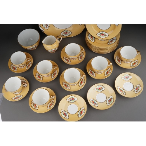 541 - A Crown Chelsea China tea set, apricot ground with printed and painted panels of flowers, comprising... 