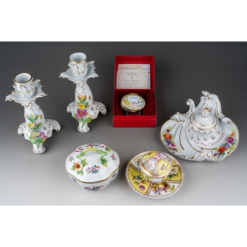 561 - A collection of 18th Century style Dresden porcelain, in the Rococo manner to include; a pair of can... 