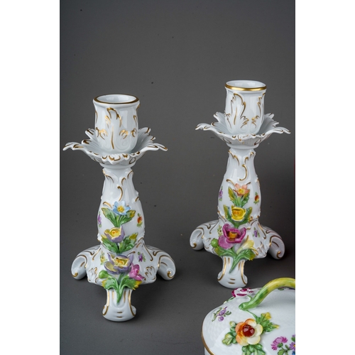 561 - A collection of 18th Century style Dresden porcelain, in the Rococo manner to include; a pair of can... 