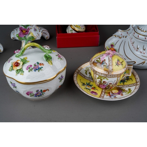 561 - A collection of 18th Century style Dresden porcelain, in the Rococo manner to include; a pair of can... 