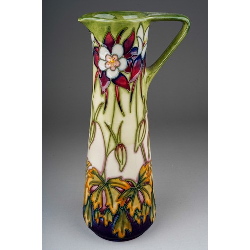 563 - A Moorcroft pottery conical jug in the Aquilegia pattern, limited edition no.166/250, circa 1999, pr... 