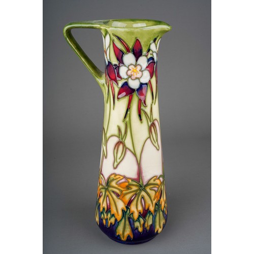 563 - A Moorcroft pottery conical jug in the Aquilegia pattern, limited edition no.166/250, circa 1999, pr... 