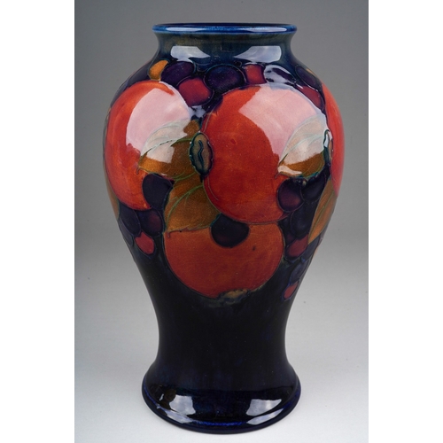 572 - A Moorcroft Pomegranate vase on cobalt blue ground, with blue Walter Moorcroft signature and impress... 