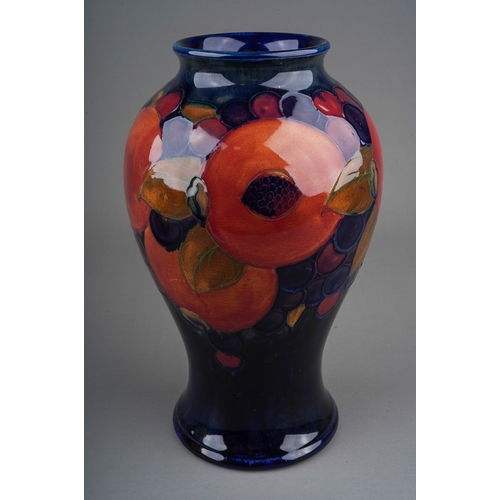 572 - A Moorcroft Pomegranate vase on cobalt blue ground, with blue Walter Moorcroft signature and impress... 