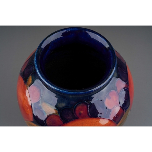 572 - A Moorcroft Pomegranate vase on cobalt blue ground, with blue Walter Moorcroft signature and impress... 