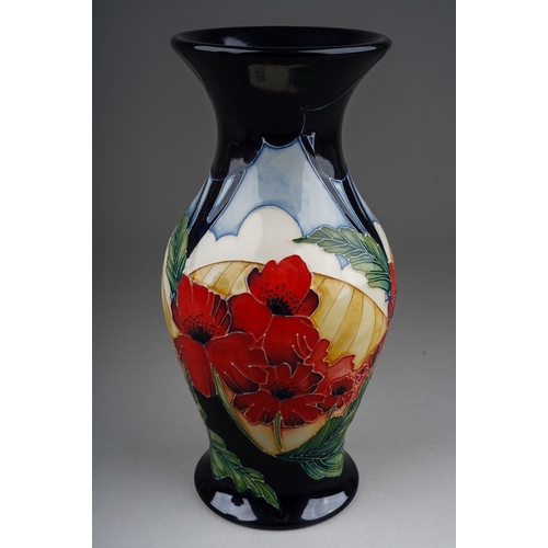 573 - A Moorcroft Poppy vase  designed in 2013, decorated with poppies with field beyond, backstamp and in... 