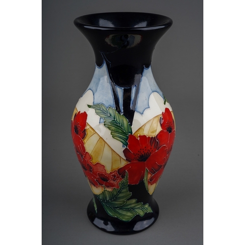 573 - A Moorcroft Poppy vase  designed in 2013, decorated with poppies with field beyond, backstamp and in... 