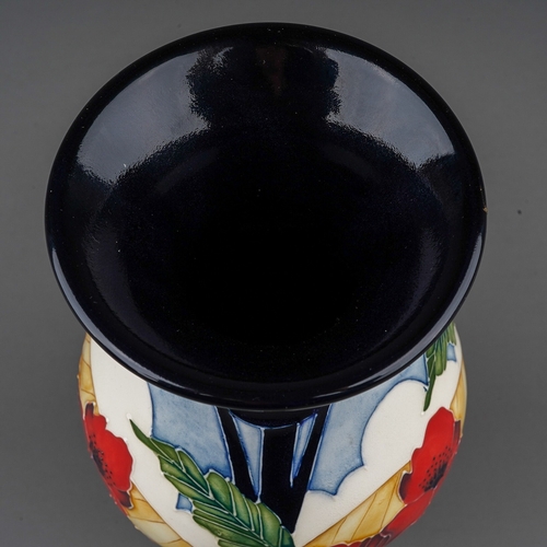 573 - A Moorcroft Poppy vase  designed in 2013, decorated with poppies with field beyond, backstamp and in... 