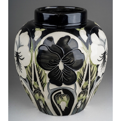 583 - A Moorcroft pottery trial ginger jar and cover decorated in Harliquinade pattern of black and white ... 