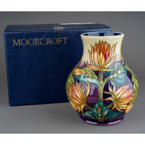 584 - A boxed Moorcroft squat baluster vase decorated in the Burdock design, circa 1999, painted and impre... 