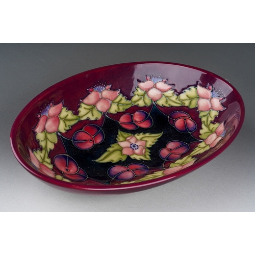 585 - A Moorcroft Collectors Club Morello bowl, designed by Rachel Bishop, oval form with cherries on a cl... 