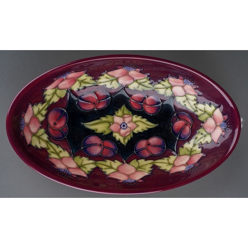 585 - A Moorcroft Collectors Club Morello bowl, designed by Rachel Bishop, oval form with cherries on a cl... 