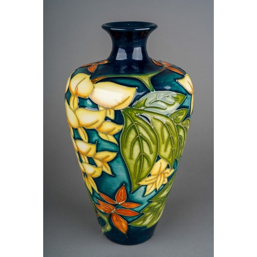 591 - A boxed Moorcroft pottery Collectors Club baluster vase in a Wisteria design, by Philip Gibson, circ... 