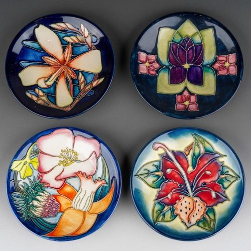 593 - Four boxed Moorcroft pottery coasters, in Simeon, circa 1999, Violet, Golden Jubilee (2002) and Moor... 