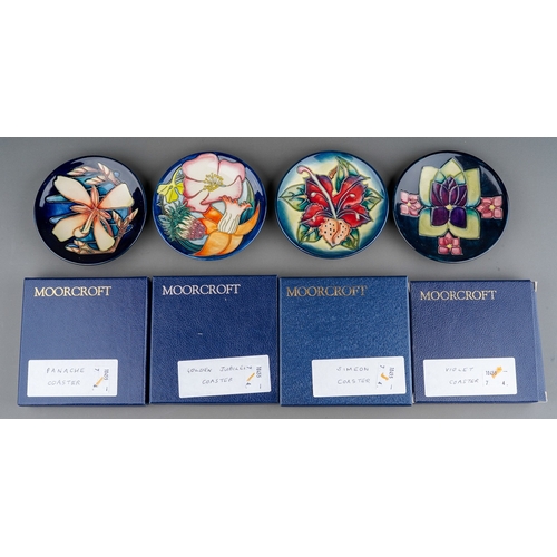 593 - Four boxed Moorcroft pottery coasters, in Simeon, circa 1999, Violet, Golden Jubilee (2002) and Moor... 