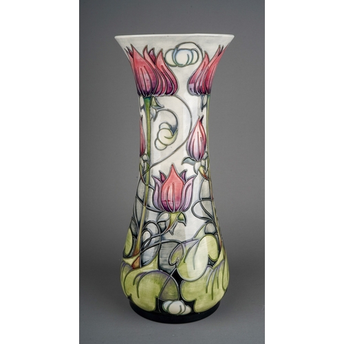 594 - A boxed Moorcroft pottery baluster vase in the trial Appledorn design by Emma Bossons, base inscribe... 