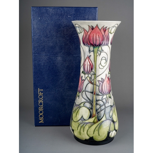 594 - A boxed Moorcroft pottery baluster vase in the trial Appledorn design by Emma Bossons, base inscribe... 