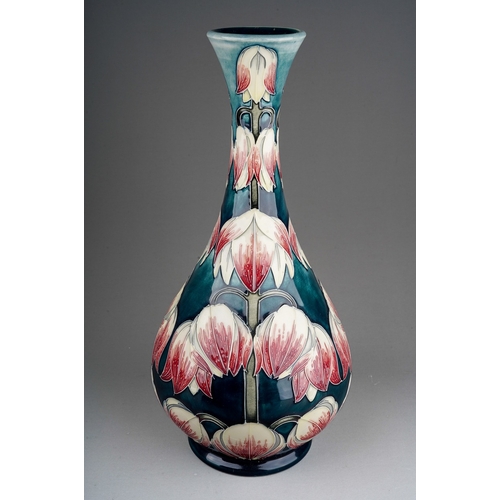 595 - A Moorcroft pottery onion shaped vase in a design trial Desert Orchid design by Anji Davenport, insc... 