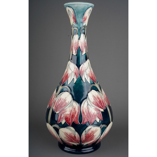 595 - A Moorcroft pottery onion shaped vase in a design trial Desert Orchid design by Anji Davenport, insc... 