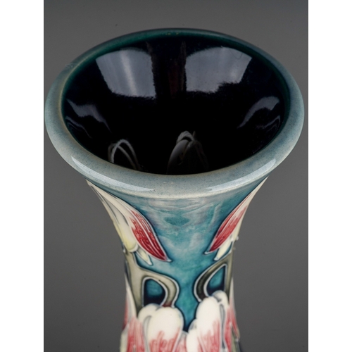 595 - A Moorcroft pottery onion shaped vase in a design trial Desert Orchid design by Anji Davenport, insc... 