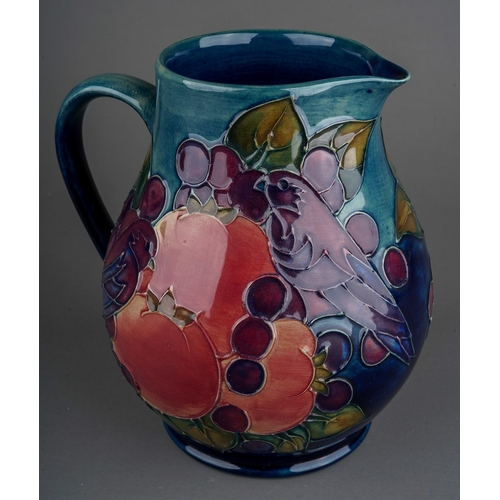 600 - A Moorcroft pottery baluster jug decorated in the Finches pattern, impressed and painted marks, heig... 