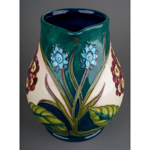 601 - A Moorcroft pottery limited edition baluster jug decorated in the Springtime at Home design by Phili... 