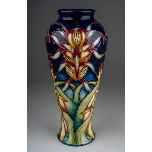 603 - A Moorcroft pottery inverted baluster vase decorated in the Lizard Orchid design by Philip Gibson, s... 