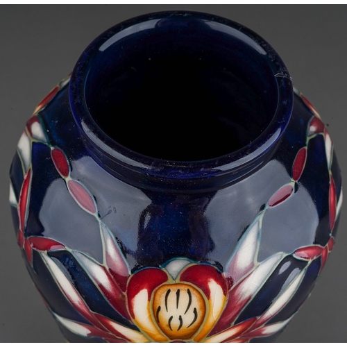 603 - A Moorcroft pottery inverted baluster vase decorated in the Lizard Orchid design by Philip Gibson, s... 